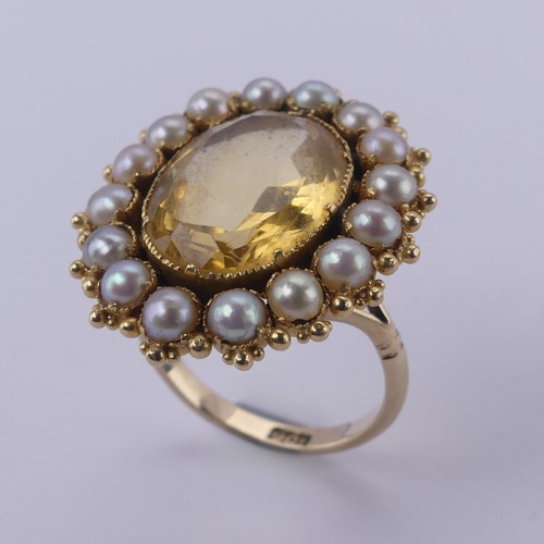 135 - An antique citrine and half pearl Cluster Ring, formed from a brooch, on a 9ct gold ring mount, the ... 