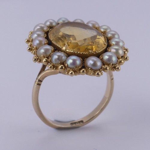 135 - An antique citrine and half pearl Cluster Ring, formed from a brooch, on a 9ct gold ring mount, the ... 