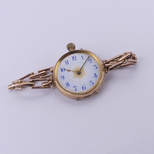 67 - A Continental 14k gold lady's Fob Watch, the pretty enamel dial with blue Arabic numerals, manual cr... 