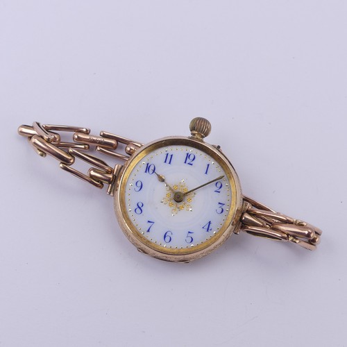 67 - A Continental 14k gold lady's Fob Watch, the pretty enamel dial with blue Arabic numerals, manual cr... 