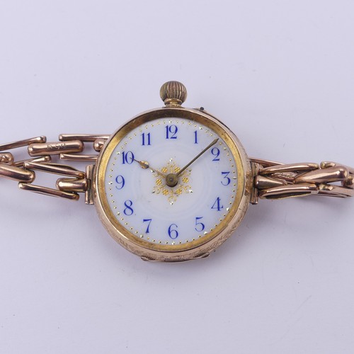 67 - A Continental 14k gold lady's Fob Watch, the pretty enamel dial with blue Arabic numerals, manual cr... 