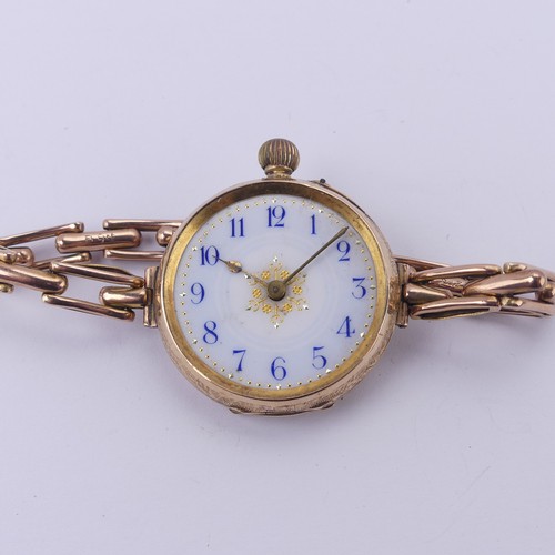 67 - A Continental 14k gold lady's Fob Watch, the pretty enamel dial with blue Arabic numerals, manual cr... 