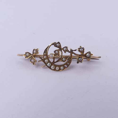 221 - A 15ct yellow gold Bar Brooch, with seed pearl set crescent moon amongst foliage, 4.5cm long, 4.1g.... 