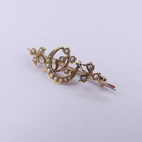 221 - A 15ct yellow gold Bar Brooch, with seed pearl set crescent moon amongst foliage, 4.5cm long, 4.1g.... 