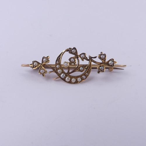 221 - A 15ct yellow gold Bar Brooch, with seed pearl set crescent moon amongst foliage, 4.5cm long, 4.1g.... 