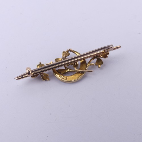 221 - A 15ct yellow gold Bar Brooch, with seed pearl set crescent moon amongst foliage, 4.5cm long, 4.1g.... 