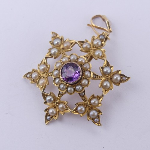 222 - An Edwardian amethyst and seed pearl Pendant / Brooch, in the form of an open star, with seed pearl ... 