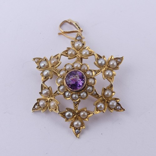 222 - An Edwardian amethyst and seed pearl Pendant / Brooch, in the form of an open star, with seed pearl ... 