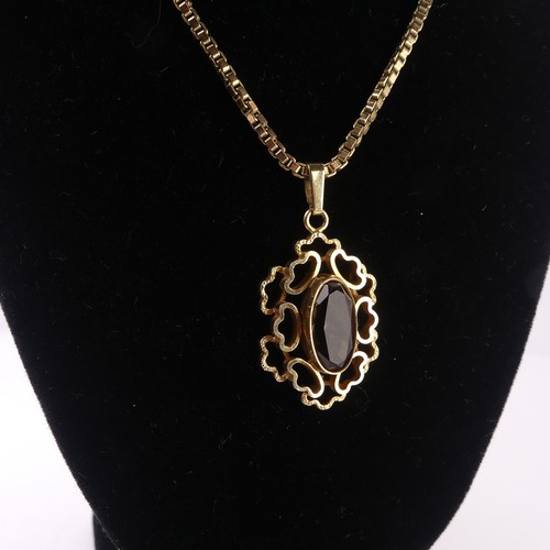 183 - An abstract 9ct yellow gold Pendant, the centre set with an oval facetted smoky quartz, 3cm long, on... 