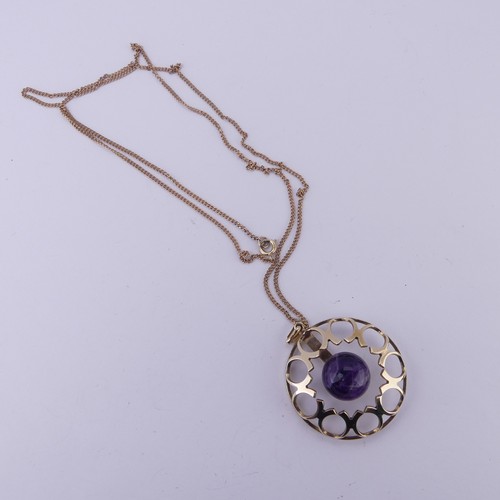 186 - A modernist amethyst 9ct gold Pendant, of open circular form with central cabochon amethyst, hallmar... 