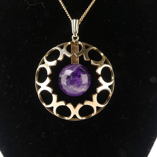 186 - A modernist amethyst 9ct gold Pendant, of open circular form with central cabochon amethyst, hallmar... 