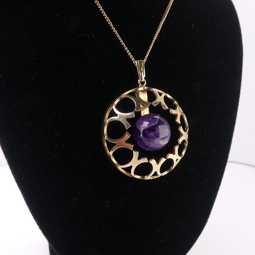 186 - A modernist amethyst 9ct gold Pendant, of open circular form with central cabochon amethyst, hallmar... 