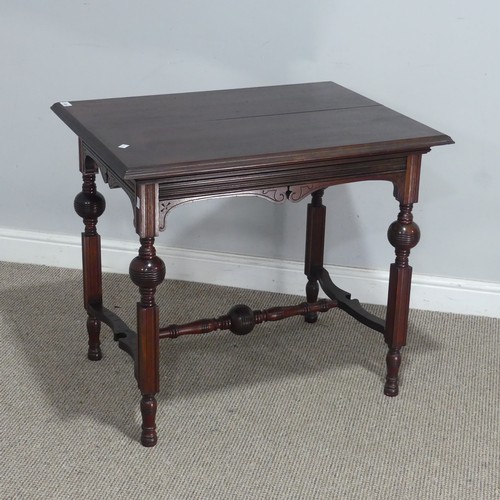 546 - An Aesthetic period mahogany Table, raised on four turned and reeded legs, united by 'H' stretcher, ... 