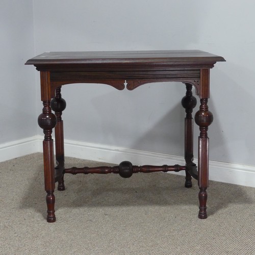 546 - An Aesthetic period mahogany Table, raised on four turned and reeded legs, united by 'H' stretcher, ... 