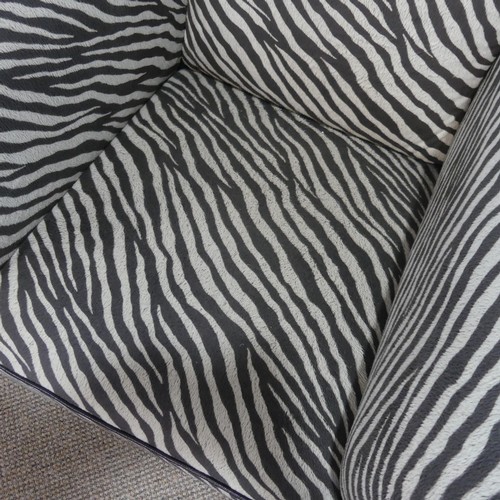 551 - A pair of Art Deco style upholstered Armchairs, with zebra pattern faux fur upholstery, W 98 cm x H ... 