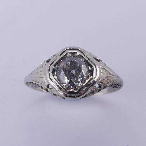 142 - A single stone diamond Ring, the circular stone approx. 0.7ct, difficult to size within the mount, i... 