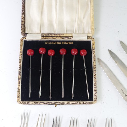 53 - A cased set of six sterling silver Cocktail Sticks, with red bakelite 'cherry' finials, together wit... 