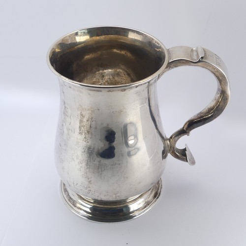 10 - A George II silver Mug, by John Kirkup, hallmarked Newcastle, 1755, of plain baluster form, the scro... 