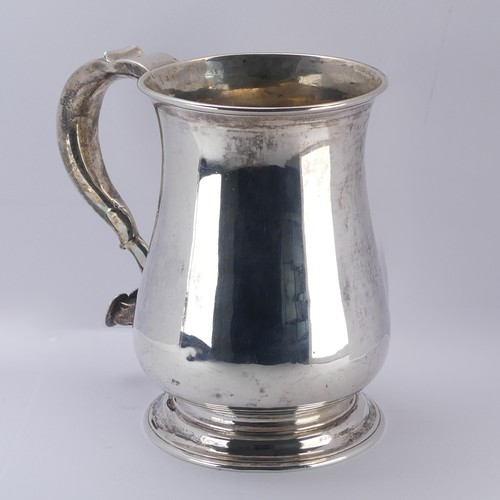 10 - A George II silver Mug, by John Kirkup, hallmarked Newcastle, 1755, of plain baluster form, the scro... 