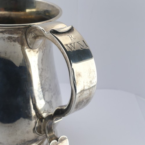 10 - A George II silver Mug, by John Kirkup, hallmarked Newcastle, 1755, of plain baluster form, the scro... 