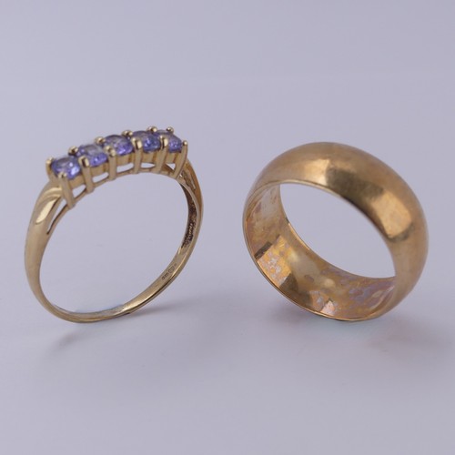 148 - A wide 9ct rose gold Band, Size Q, 7.3g, together with a five stone tanzanite ring, mounted in 9ct y... 