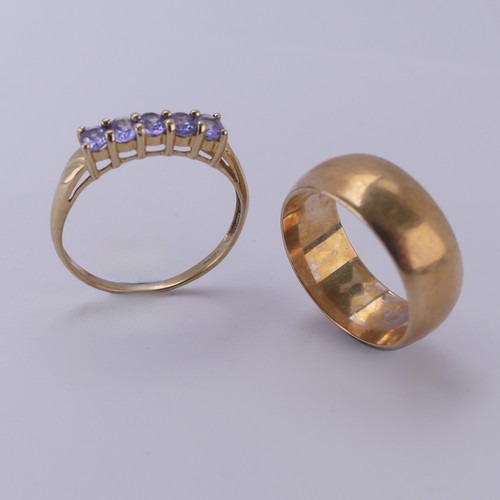 148 - A wide 9ct rose gold Band, Size Q, 7.3g, together with a five stone tanzanite ring, mounted in 9ct y... 