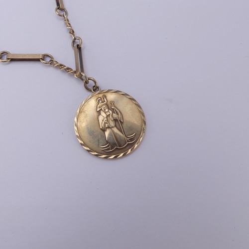 189 - A 9ct yellow gold St. Christopher Pendant, on an integral fancy link chain, the pendant 26mm diamete... 