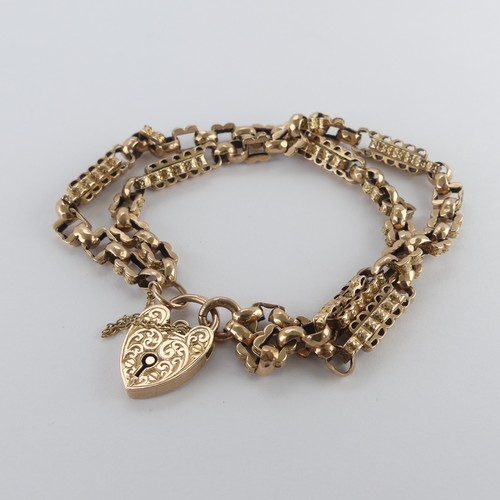 212 - A 9ct yellow and rose gold Bracelet, formed as a double row part watch chain, with 9ct gold padlock ... 