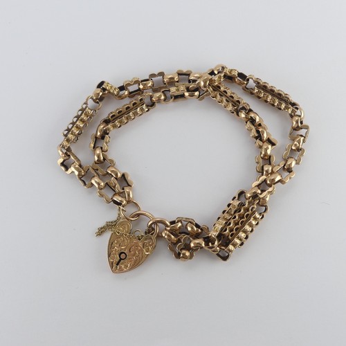 212 - A 9ct yellow and rose gold Bracelet, formed as a double row part watch chain, with 9ct gold padlock ... 