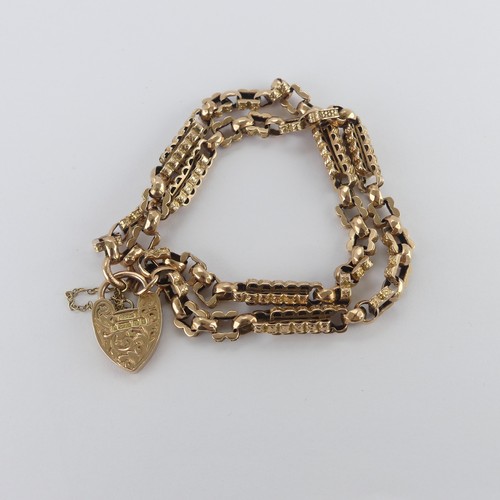 212 - A 9ct yellow and rose gold Bracelet, formed as a double row part watch chain, with 9ct gold padlock ... 