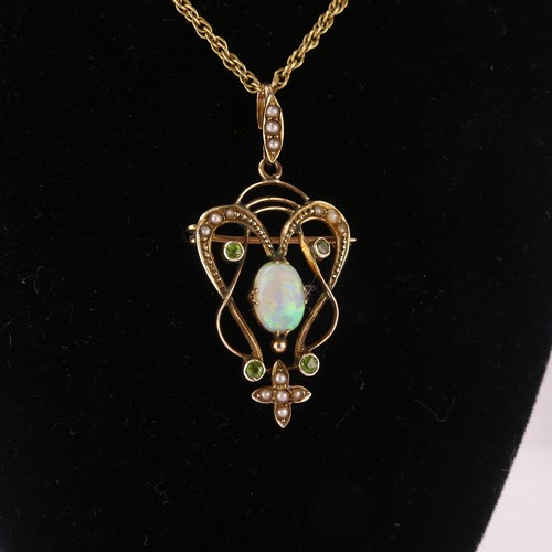 192 - An Art Nouveau opal Pendant, the central oval opal in scrolling open surround set demantoid garnets ... 