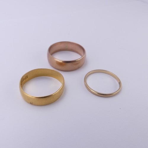 255 - A 22ct yellow gold Band, 5.4mm wide, Size Q, 3.6g, together with two 9ct gold bands; one narrow yell... 