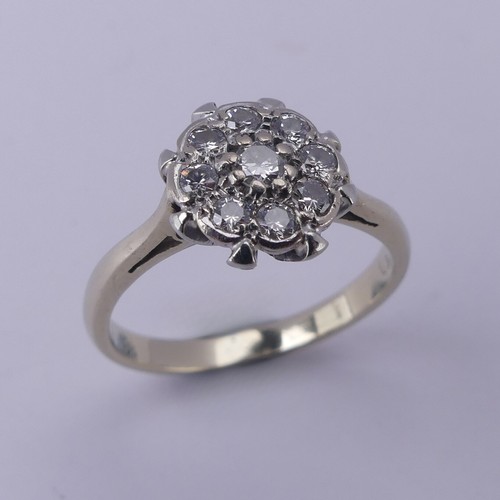 156 - A diamond cluster Ring, the central circular diamond with eight stones around, all claw set in 18ct ... 