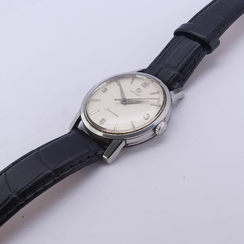 83 - A vintage Omega Seamaster stainless steel Wristwatch, the oyster coloured dial with steel baton mark... 