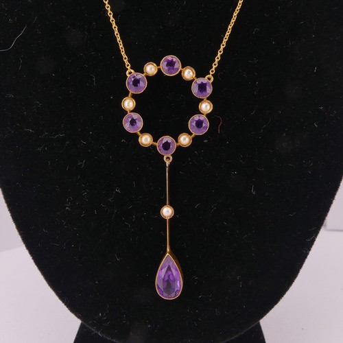 201 - An Edwardian amethyst and seed pearl Pendant, the open circular pendant with knife wire drop below s... 