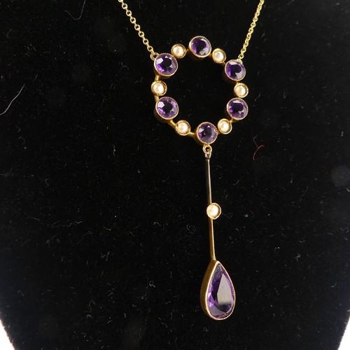 201 - An Edwardian amethyst and seed pearl Pendant, the open circular pendant with knife wire drop below s... 