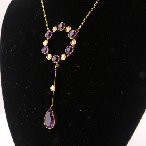 201 - An Edwardian amethyst and seed pearl Pendant, the open circular pendant with knife wire drop below s... 