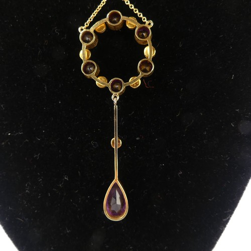 201 - An Edwardian amethyst and seed pearl Pendant, the open circular pendant with knife wire drop below s... 