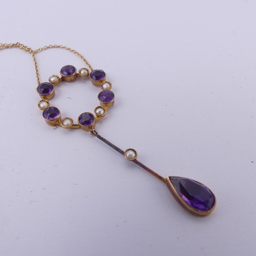 201 - An Edwardian amethyst and seed pearl Pendant, the open circular pendant with knife wire drop below s... 