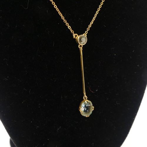 202 - An Edwardian aquamarine Pendant, with a millegrain set circular stone supending on a knifewire a cla... 