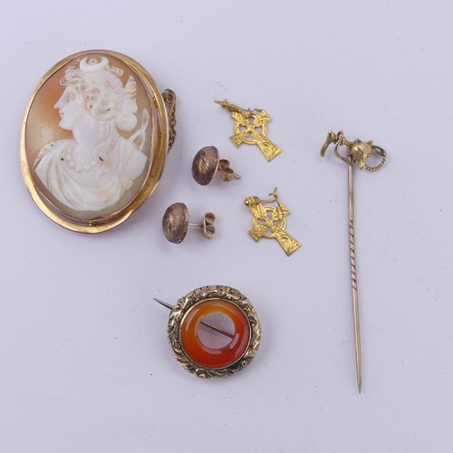 261 - A 9ct yellow gold mounted oval shell Cameo Brooch, together with a stickpin with fox mask and riding... 