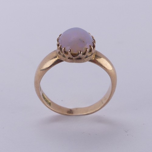 162 - An oval opal Ring, the stone approx. 10mm long, claw set in 15ct gold, Size L, 4.2g.... 