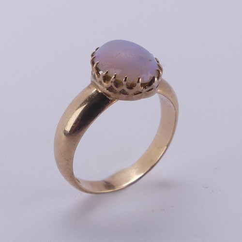 162 - An oval opal Ring, the stone approx. 10mm long, claw set in 15ct gold, Size L, 4.2g.... 