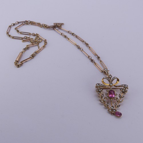 204 - An Edwardian seed pearl and pink tourmaline Pendant / Brooch, in the Art Nouveau style with seed pea... 