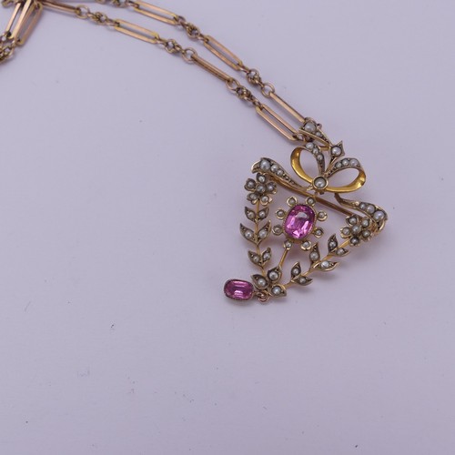 204 - An Edwardian seed pearl and pink tourmaline Pendant / Brooch, in the Art Nouveau style with seed pea... 