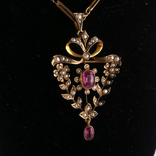 204 - An Edwardian seed pearl and pink tourmaline Pendant / Brooch, in the Art Nouveau style with seed pea... 