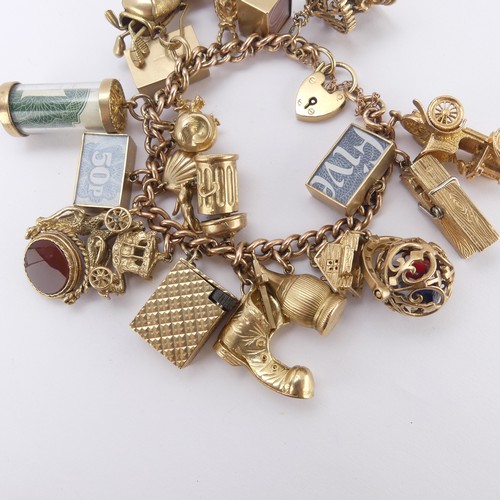 215 - A 9ct rose gold curb link Bracelet, with 9ct gold padlock clasp, suspended with 22 various 9ct gold ... 