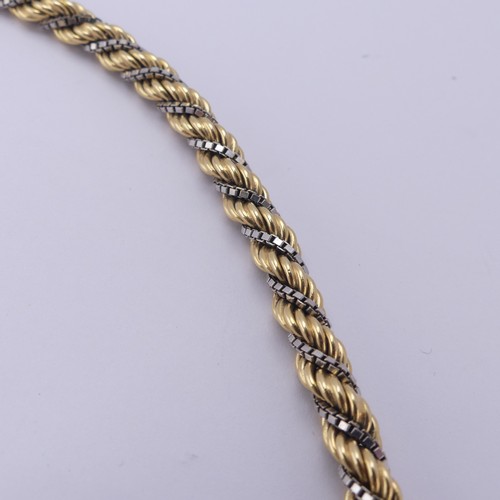 216 - An 18ct yellow and white gold ropetwist Bracelet, with small bolt ring clasp, 21cm long, 21.2g.... 