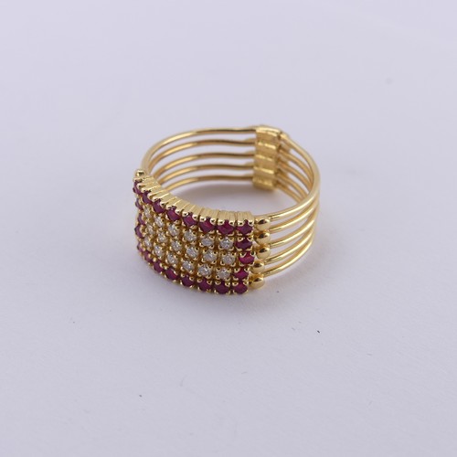 266 - An 18ct yellow gold multi-strand Ring, the five strands variously set with rubies and diamonds, hing... 