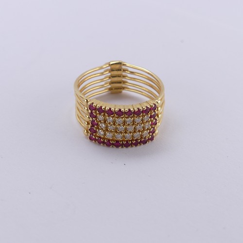 266 - An 18ct yellow gold multi-strand Ring, the five strands variously set with rubies and diamonds, hing... 